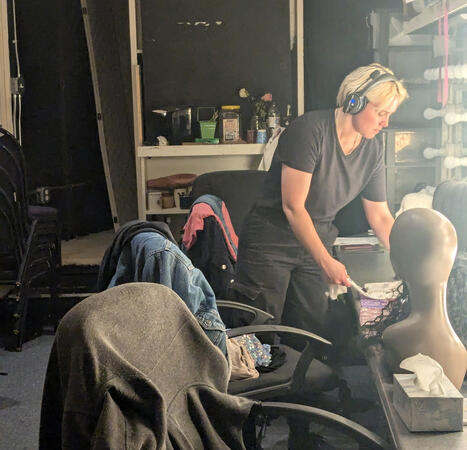 Hayden tidying the dressing room at Scripps Ranch Theatre